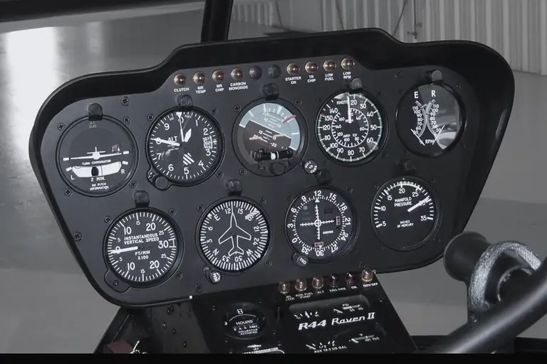 Round-dial flight instruments in a Robinson R44 Raven II helicopter panel: turn coordinator, altimeter, attitude indicator, airspeed indicator, vertical speed indicator and directional gyro