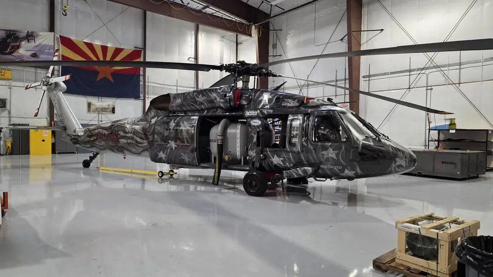 UH-60 Black Hawk with a custom star livery in a hangar
