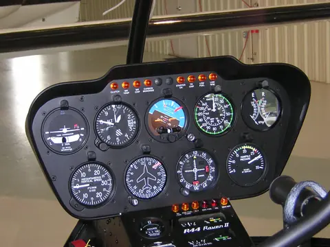 Robinson R44 Raven II panel with round-dial attitude indicator, altimeter, airspeed, turn coordinator, VSI and directional gyro