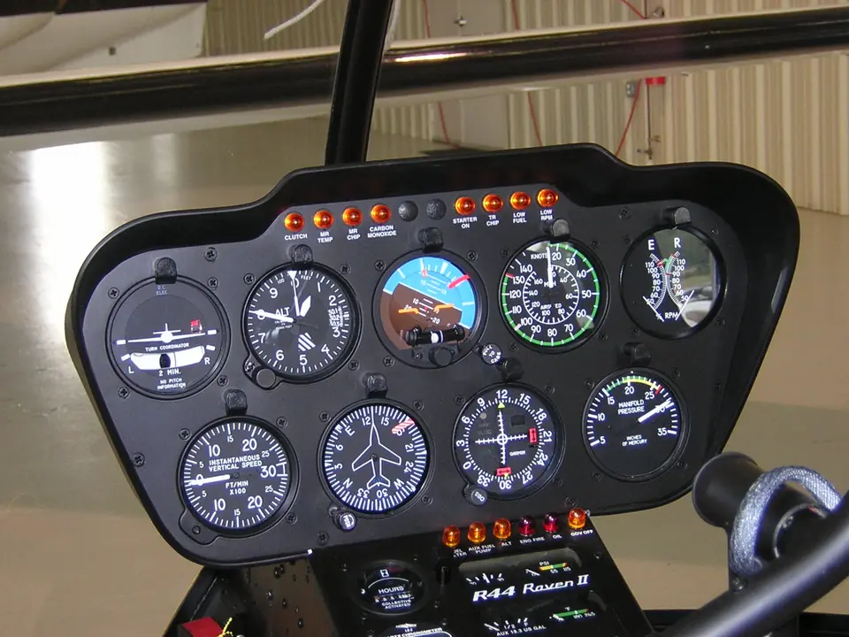 Robinson R44 Raven II panel with round-dial attitude indicator, altimeter, airspeed, turn coordinator, VSI and directional gyro